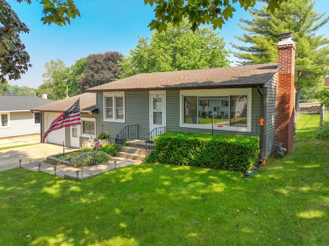 274 Crystal Ave, South Elgin, IL 60177 - view of front facade with a garage, concrete driveway, a chimney, and a shingled roof