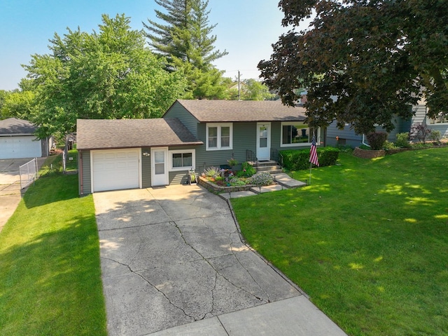 274 Crystal Ave, South Elgin, IL 60177 - tri-level home featuring a garage, concrete driveway, a front yard, and a shingled roof