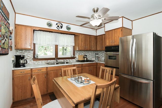 274 Crystal Ave, South Elgin, IL 60177 - kitchen featuring stainless steel appliances, tasteful backsplash, light countertops, and brown cabinetry