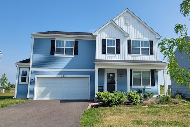 404 Radcliff Ln, South Elgin, IL 60177 - traditional-style house with board and batten siding, an attached garage, asphalt driveway, a front yard, and a porch