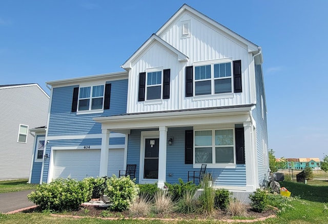 404 Radcliff Ln, South Elgin, IL 60177 - view of front of house with a porch, a garage, and board and batten siding