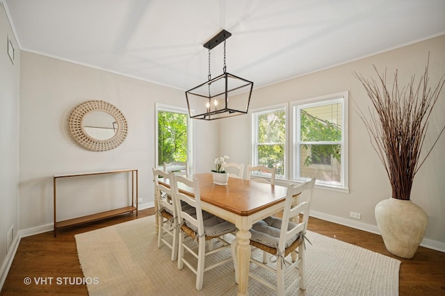 503 Oakdale Ave, Glencoe, IL 60022 - dining area featuring ornamental molding, wood finished floors, and a chandelier