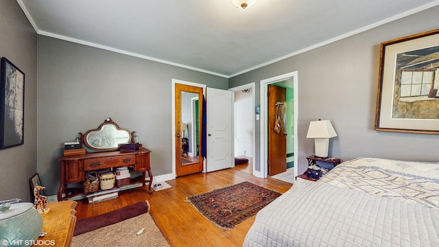 816 Rosedale Ter, Crete, IL 60417 - bedroom featuring wood finished floors, ornamental molding, and baseboards