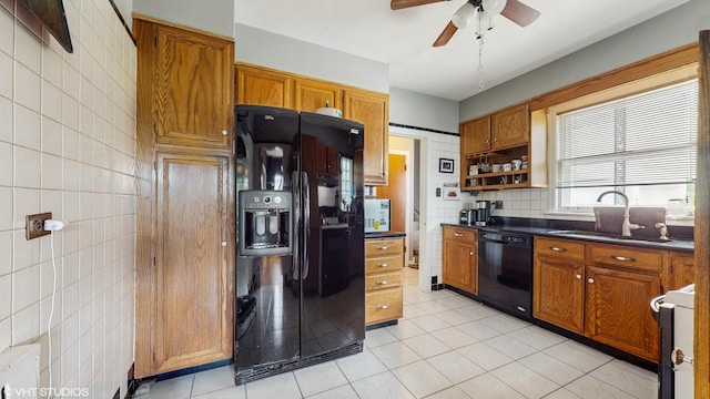 816 Rosedale Ter, Crete, IL 60417 - kitchen with black appliances, a sink, tile walls, light tile patterned floors, and dark countertops
