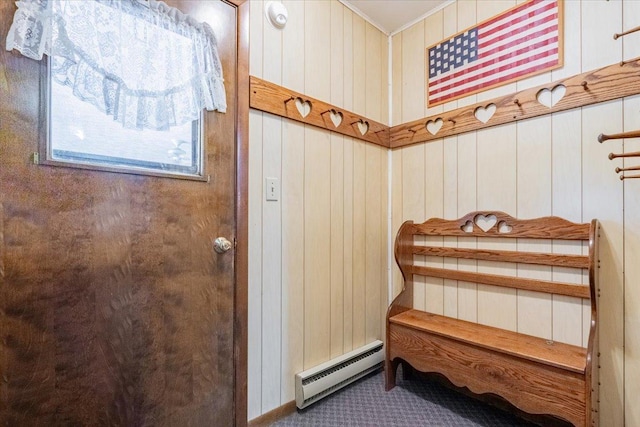 419 Circle Dr, Odell, IL 60460 - doorway with a baseboard heating unit, carpet, crown molding, and wooden walls