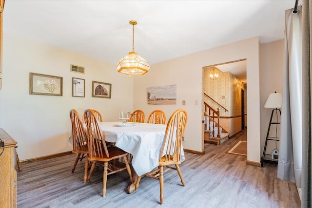419 Circle Dr, Odell, IL 60460 - dining room featuring wood finished floors and stairs