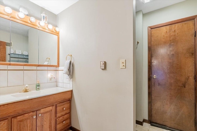 419 Circle Dr, Odell, IL 60460 - bathroom featuring vanity and decorative backsplash
