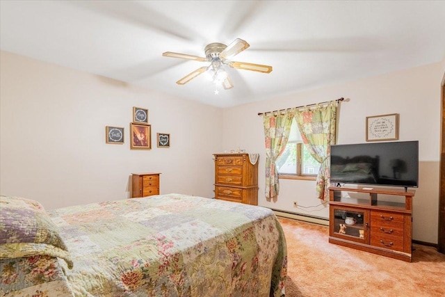419 Circle Dr, Odell, IL 60460 - bedroom with a baseboard radiator, light colored carpet, and a ceiling fan