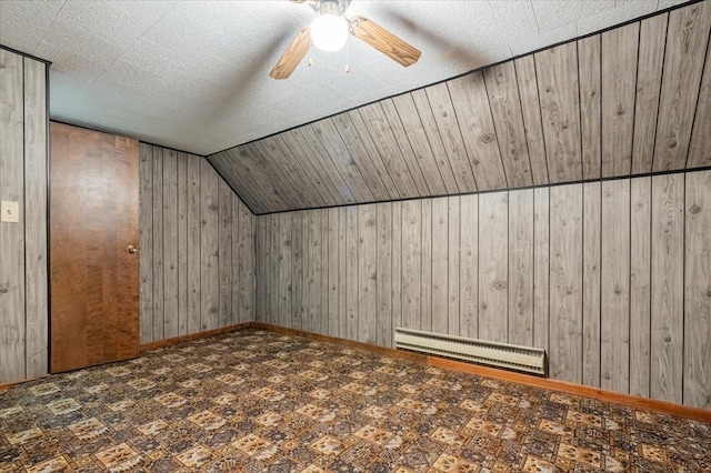 419 Circle Dr, Odell, IL 60460 - bonus room with baseboard heating, wooden walls, lofted ceiling, and a ceiling fan