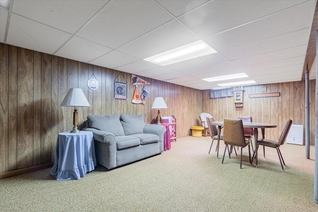 419 Circle Dr, Odell, IL 60460 - living area with carpet flooring, a paneled ceiling, and wooden walls