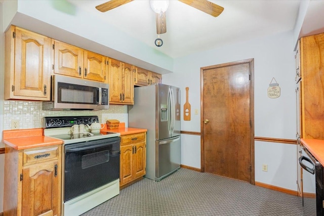 419 Circle Dr, Odell, IL 60460 - kitchen featuring stainless steel appliances, ceiling fan, light colored carpet, light countertops, and tasteful backsplash