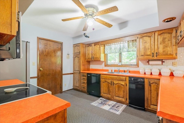 419 Circle Dr, Odell, IL 60460 - kitchen with black dishwasher, light carpet, tasteful backsplash, and brown cabinets