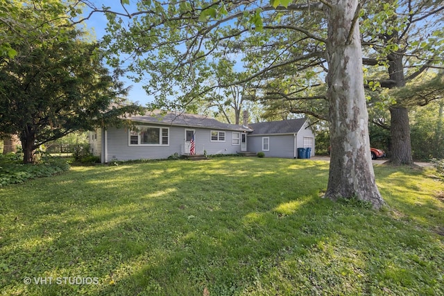 901 E Krage Dr, Addison, IL 60101 - rear view of house featuring a yard