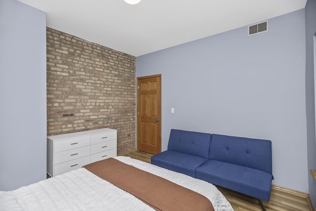 5252 S Drexel Ave Unit 2A, Chicago, IL 60615 - bedroom featuring wood finished floors and brick wall