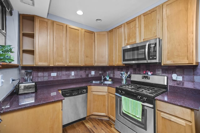5252 S Drexel Ave Unit 2A, Chicago, IL 60615 - kitchen featuring appliances with stainless steel finishes, a sink, open shelves, dark stone countertops, and tasteful backsplash