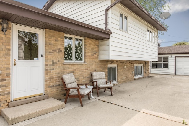 305 Denver Dr, Des Plaines, IL 60018 - doorway to property with brick siding and a patio area