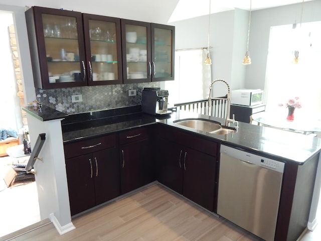 355 Wentworth Ln, Bartlett, IL 60103 - kitchen featuring a sink, dishwasher, a peninsula, white microwave, and light wood finished floors