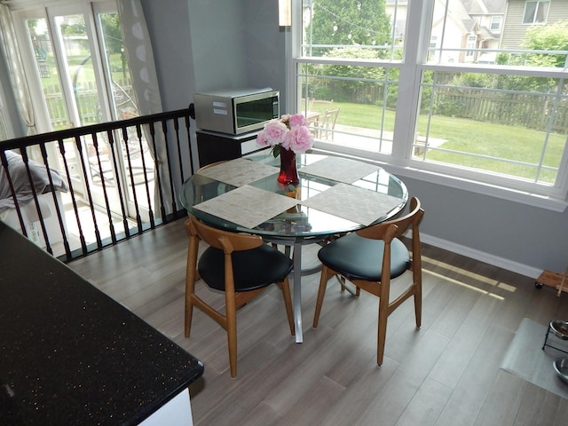 355 Wentworth Ln, Bartlett, IL 60103 - dining area featuring healthy amount of natural light, baseboards, and wood finished floors