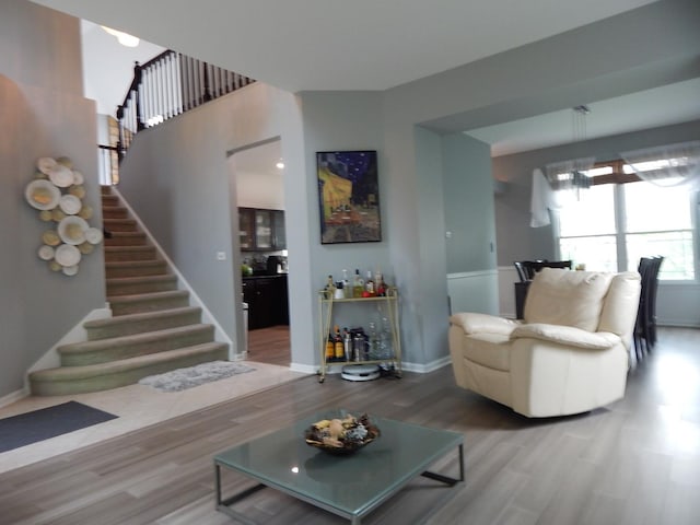 355 Wentworth Ln, Bartlett, IL 60103 - living area with stairs, wood finished floors, and baseboards