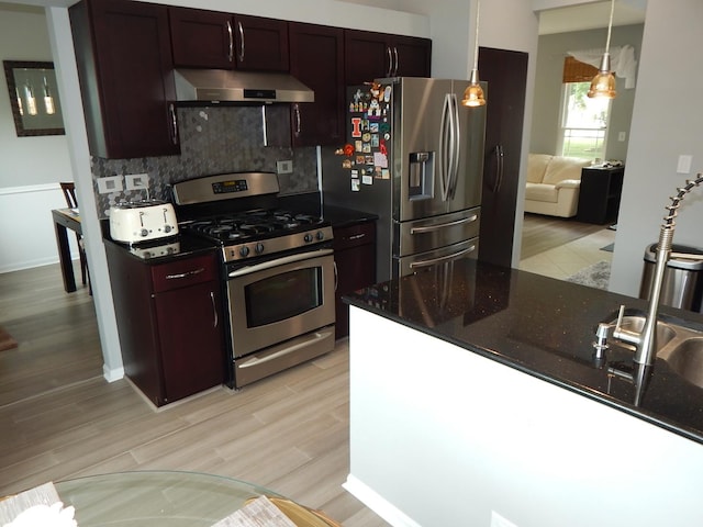 355 Wentworth Ln, Bartlett, IL 60103 - kitchen with ventilation hood, stainless steel appliances, backsplash, light wood finished floors, and dark brown cabinets