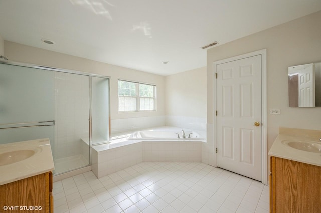 5436 Swan Cir, Hoffman Estates, IL 60192 - full bath featuring two vanities, tile patterned floors, a garden tub, and a shower stall