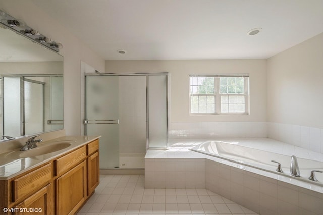 5436 Swan Cir, Hoffman Estates, IL 60192 - bathroom featuring vanity, a bath, a stall shower, and tile patterned floors