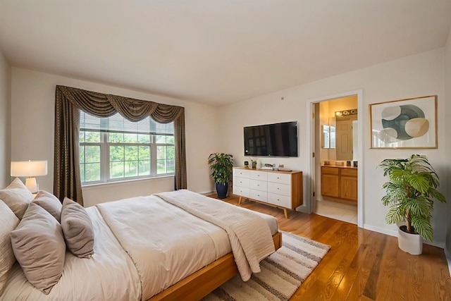 5436 Swan Cir, Hoffman Estates, IL 60192 - bedroom with light wood-style flooring and ensuite bath