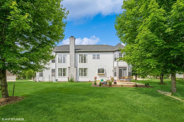 5436 Swan Cir, Hoffman Estates, IL 60192 - rear view of property with a patio area, a lawn, and a chimney
