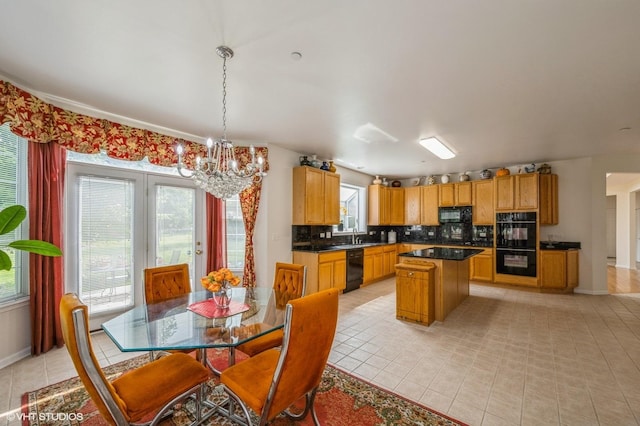 5436 Swan Cir, Hoffman Estates, IL 60192 - kitchen featuring black appliances, plenty of natural light, and a chandelier