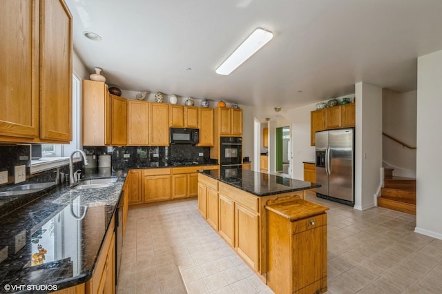 5436 Swan Cir, Hoffman Estates, IL 60192 - kitchen with black appliances, a center island, tasteful backsplash, dark stone countertops, and light tile patterned floors