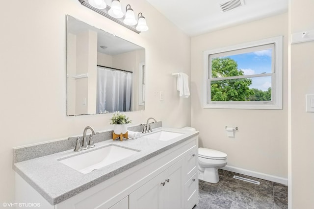 11 Willow Ct, Spring Valley, IL 61362 - full bath featuring double vanity, toilet, and baseboards