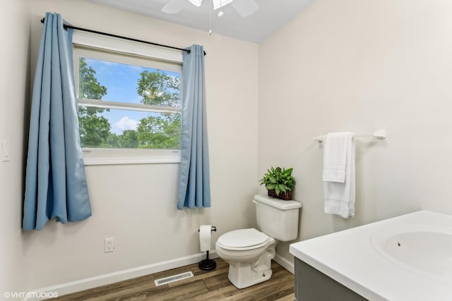11 Willow Ct, Spring Valley, IL 61362 - bathroom with wood finished floors, a ceiling fan, vanity, toilet, and baseboards