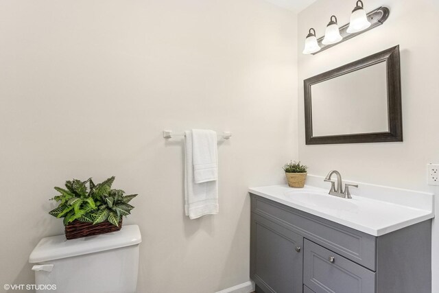 11 Willow Ct, Spring Valley, IL 61362 - half bathroom with toilet, vanity, and baseboards