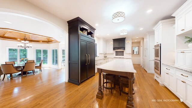 2515 Thurston Ct, Aurora, IL 60502 - kitchen with open shelves, recessed lighting, white cabinets, a chandelier, and a center island