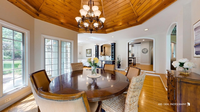 2515 Thurston Ct, Aurora, IL 60502 - dining room with arched walkways, wooden ceiling, a chandelier, light wood-style flooring, and recessed lighting