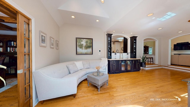 2515 Thurston Ct, Aurora, IL 60502 - living room with light wood-style flooring, recessed lighting, vaulted ceiling, and ornate columns