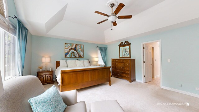2515 Thurston Ct, Aurora, IL 60502 - bedroom featuring light colored carpet, a raised ceiling, and a ceiling fan