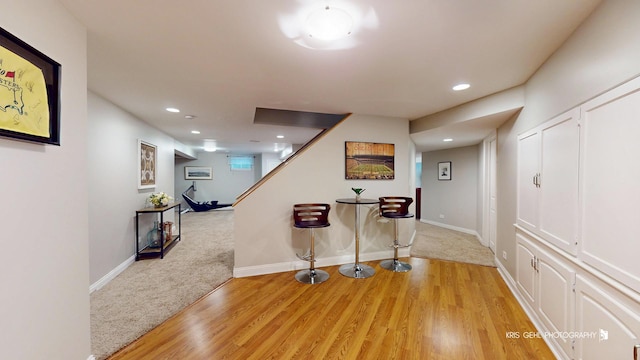 2515 Thurston Ct, Aurora, IL 60502 - hall featuring light wood finished floors, recessed lighting, stairs, and light colored carpet
