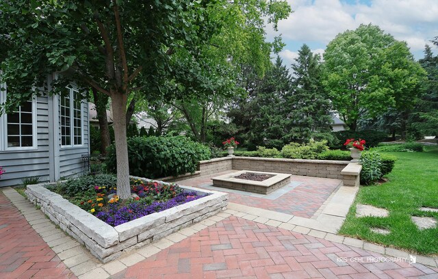 2515 Thurston Ct, Aurora, IL 60502 - view of patio featuring a fire pit