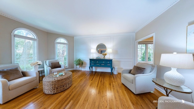 2515 Thurston Ct, Aurora, IL 60502 - living area with wood finished floors, healthy amount of natural light, and crown molding