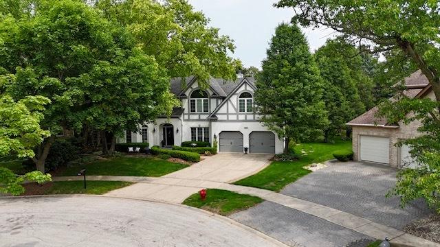 2515 Thurston Ct, Aurora, IL 60502 - view of front facade with a front yard, stucco siding, and driveway
