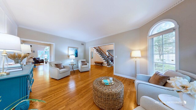 2515 Thurston Ct, Aurora, IL 60502 - living area with ornamental molding, light wood-style flooring, and stairway
