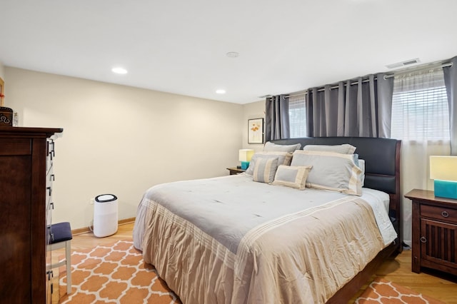5055 N California Ave Unit 1S, Chicago, IL 60625 - bedroom featuring multiple windows, light wood-style flooring, and recessed lighting