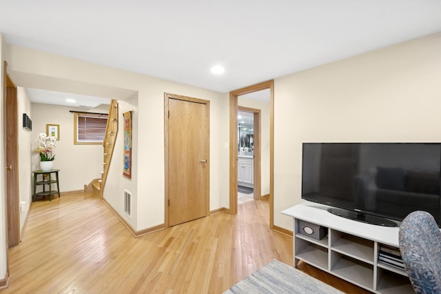5055 N California Ave Unit 1S, Chicago, IL 60625 - living room featuring light wood finished floors, stairway, and recessed lighting