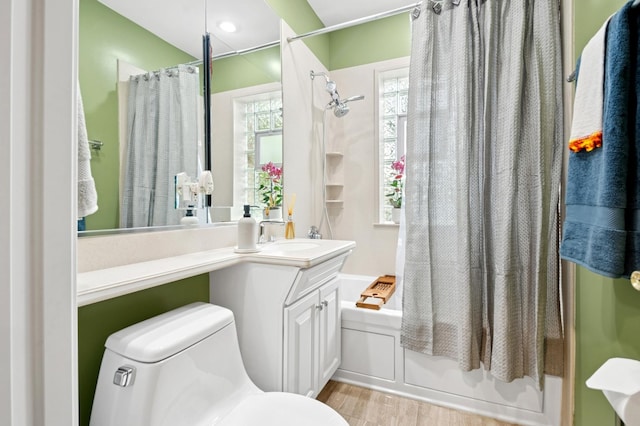 5055 N California Ave Unit 1S, Chicago, IL 60625 - full bathroom featuring shower / tub combo, vanity, and wood finished floors