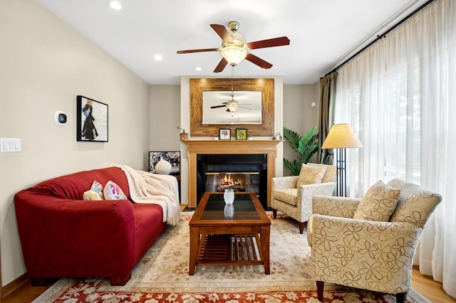 5055 N California Ave Unit 1S, Chicago, IL 60625 - living area featuring a ceiling fan, a glass covered fireplace, recessed lighting, and wood finished floors