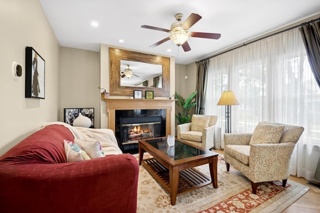 5055 N California Ave Unit 1S, Chicago, IL 60625 - living room with a glass covered fireplace, a ceiling fan, recessed lighting, and light wood-style floors