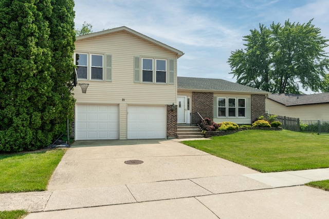 31 W Devon Ave, Glendale Heights, IL 60139 - split level home with a garage, concrete driveway, and brick siding