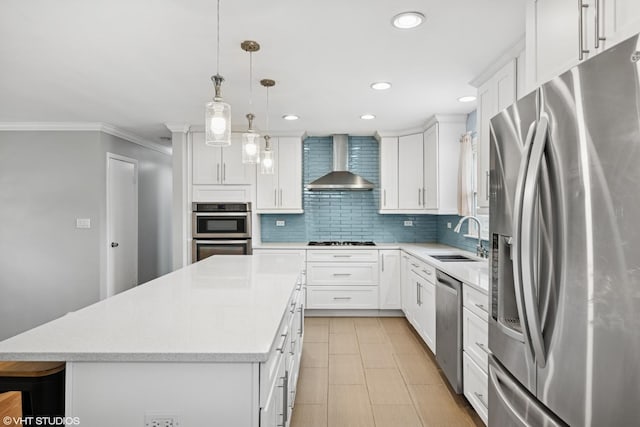 102 S Grant Dr, Addison, IL 60101 - kitchen featuring appliances with stainless steel finishes, wall chimney range hood, a kitchen island, light countertops, and decorative backsplash
