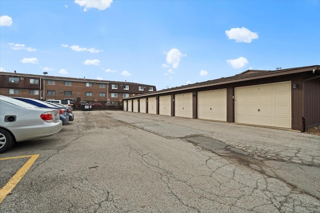 47 Pier Dr Unit 102, Westmont, IL 60559 - view of parking / parking lot with community garages